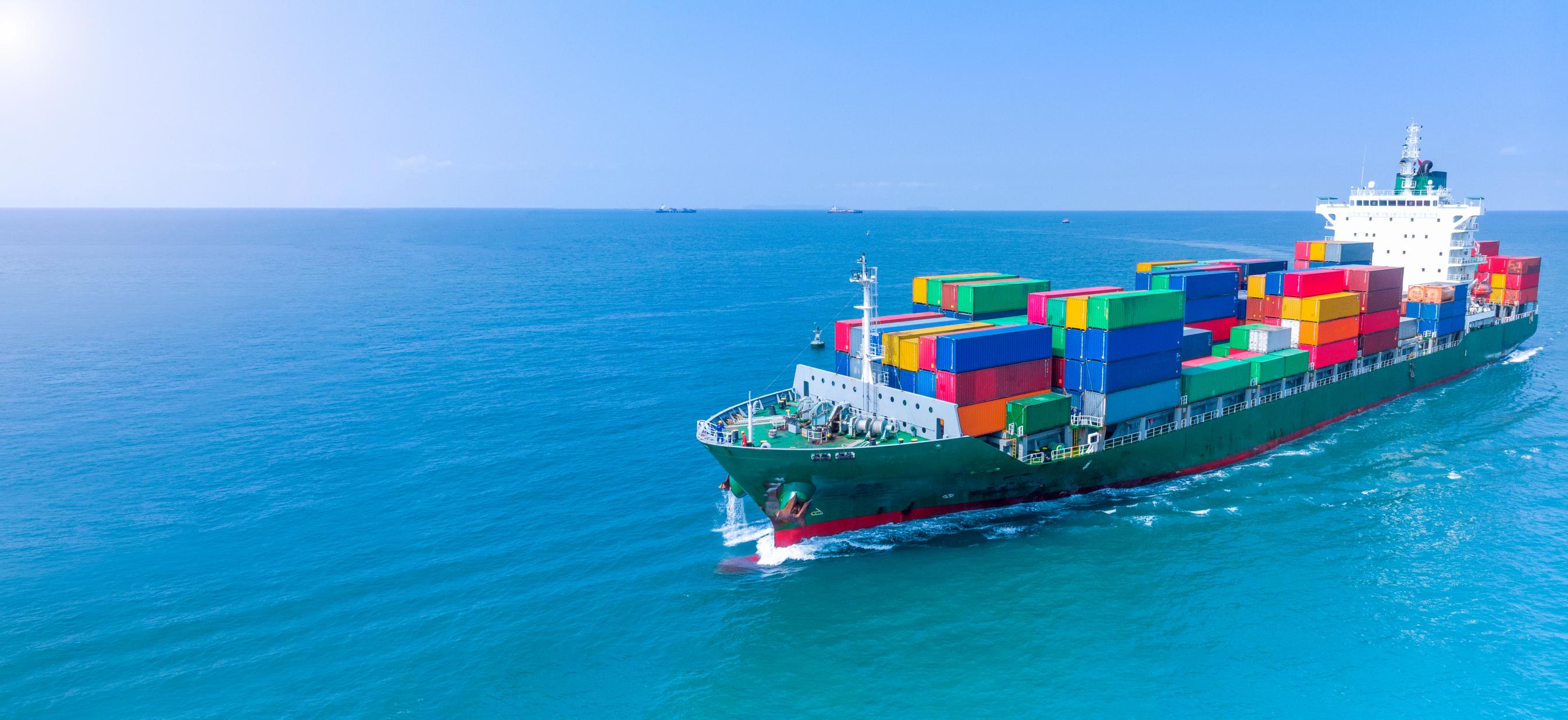 aerial infront cargo ship carrying container running export goods from cargo yard port custom ocean concept freight shipping by ship