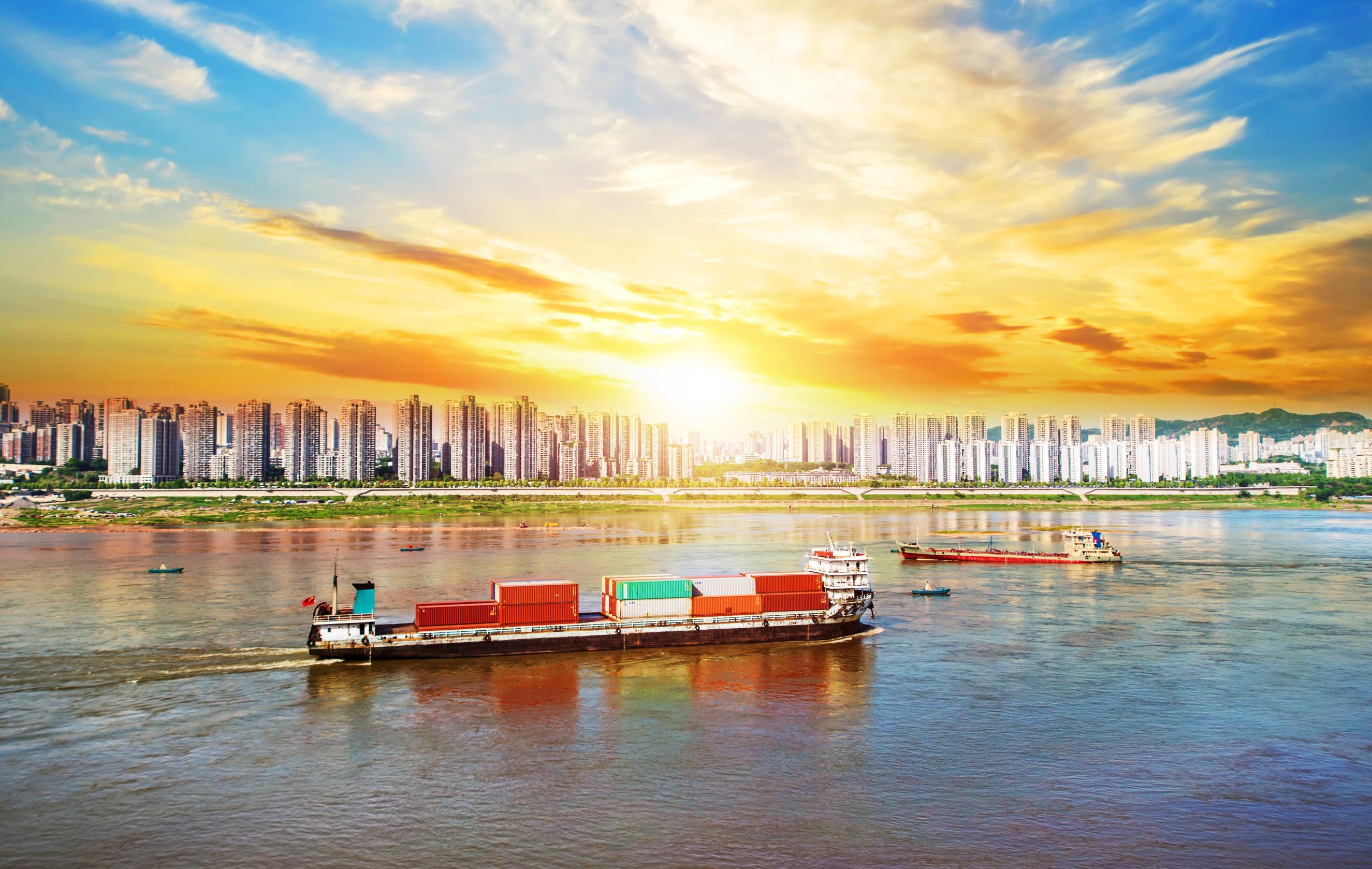 ship with containers by river