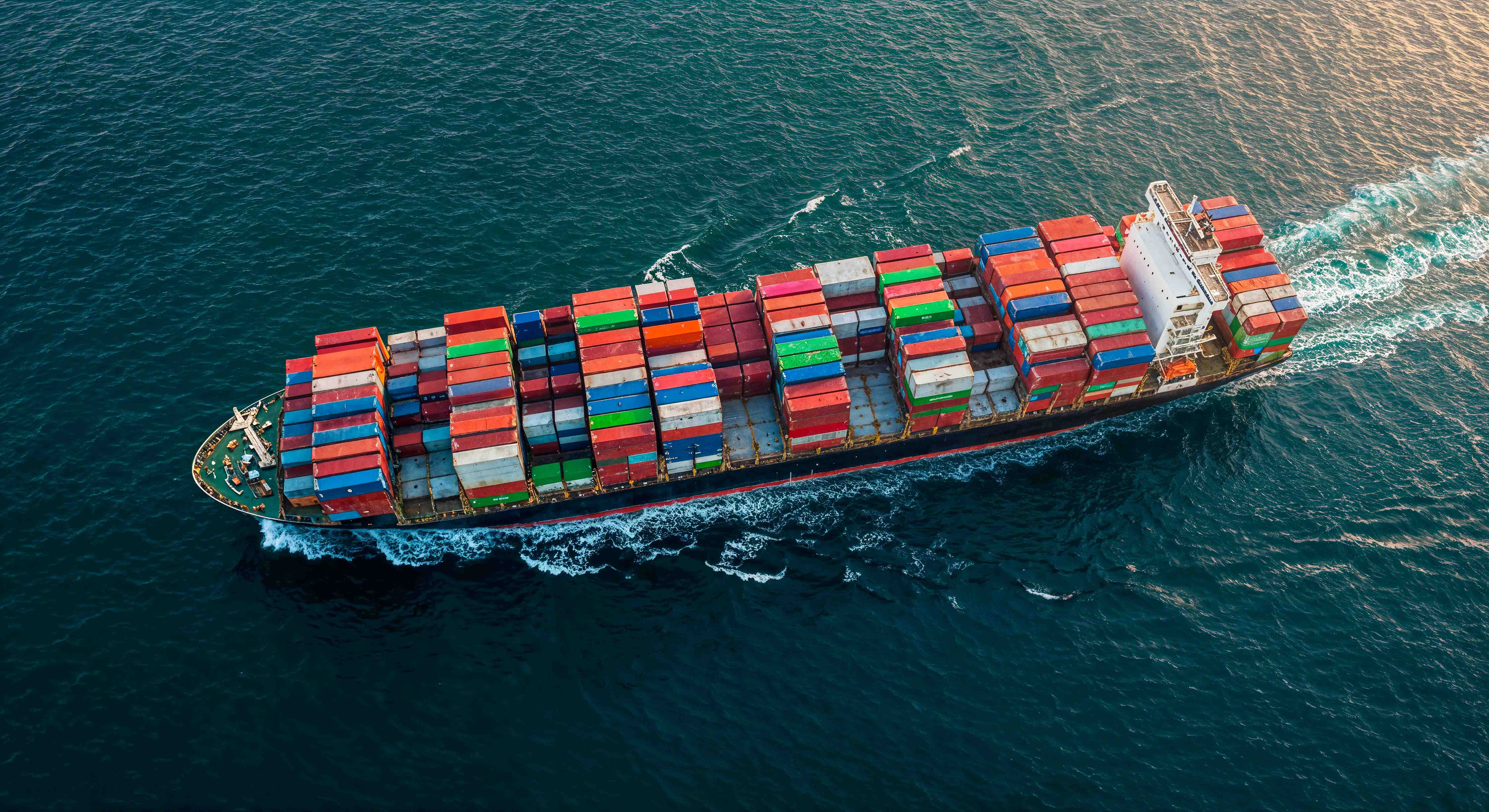 cargo ship carrying shipping containers ocean.jpg cargo ship carrying shipping containers ocean.jpg