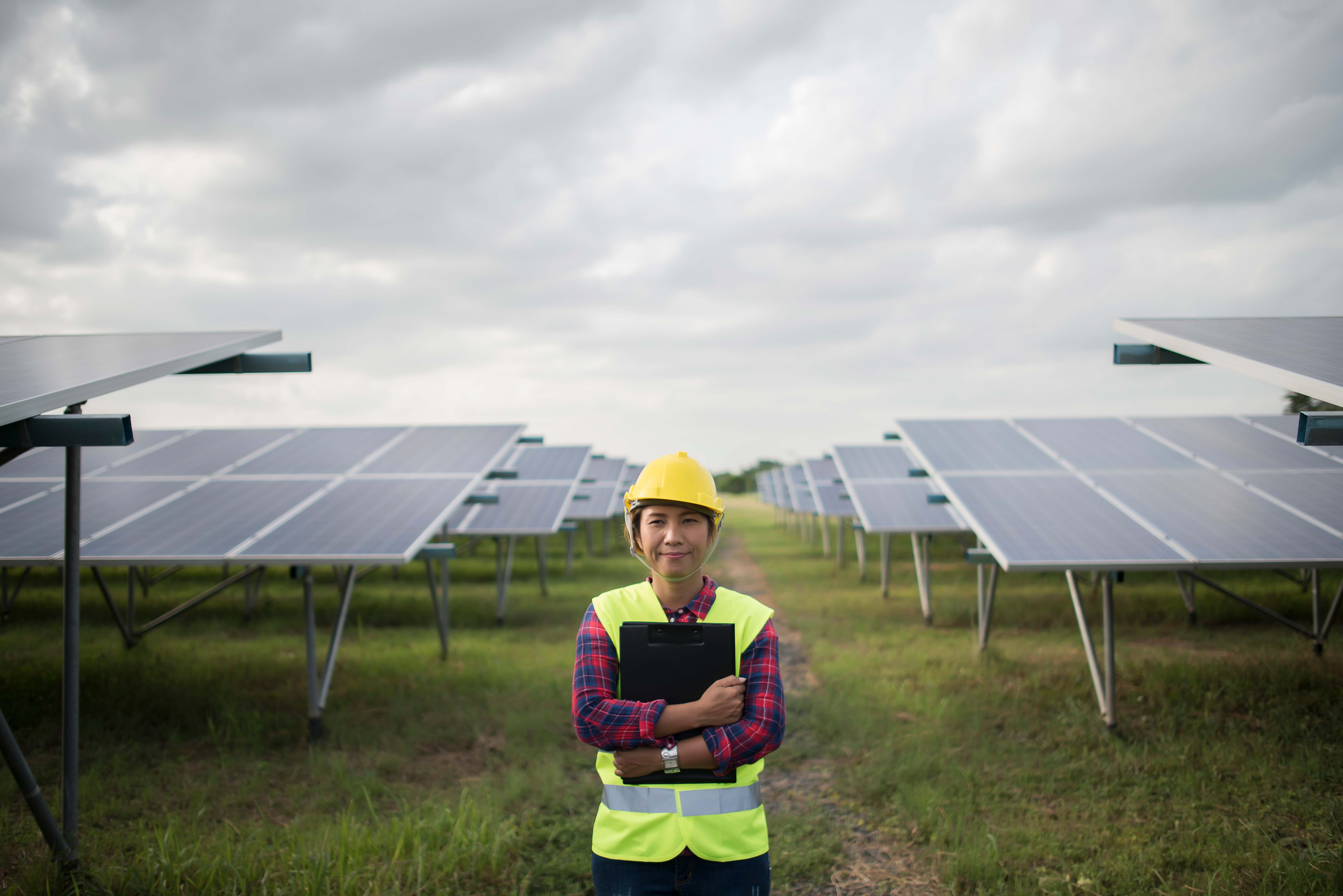 engineer electric woman checking maintenance solar cells.jpg