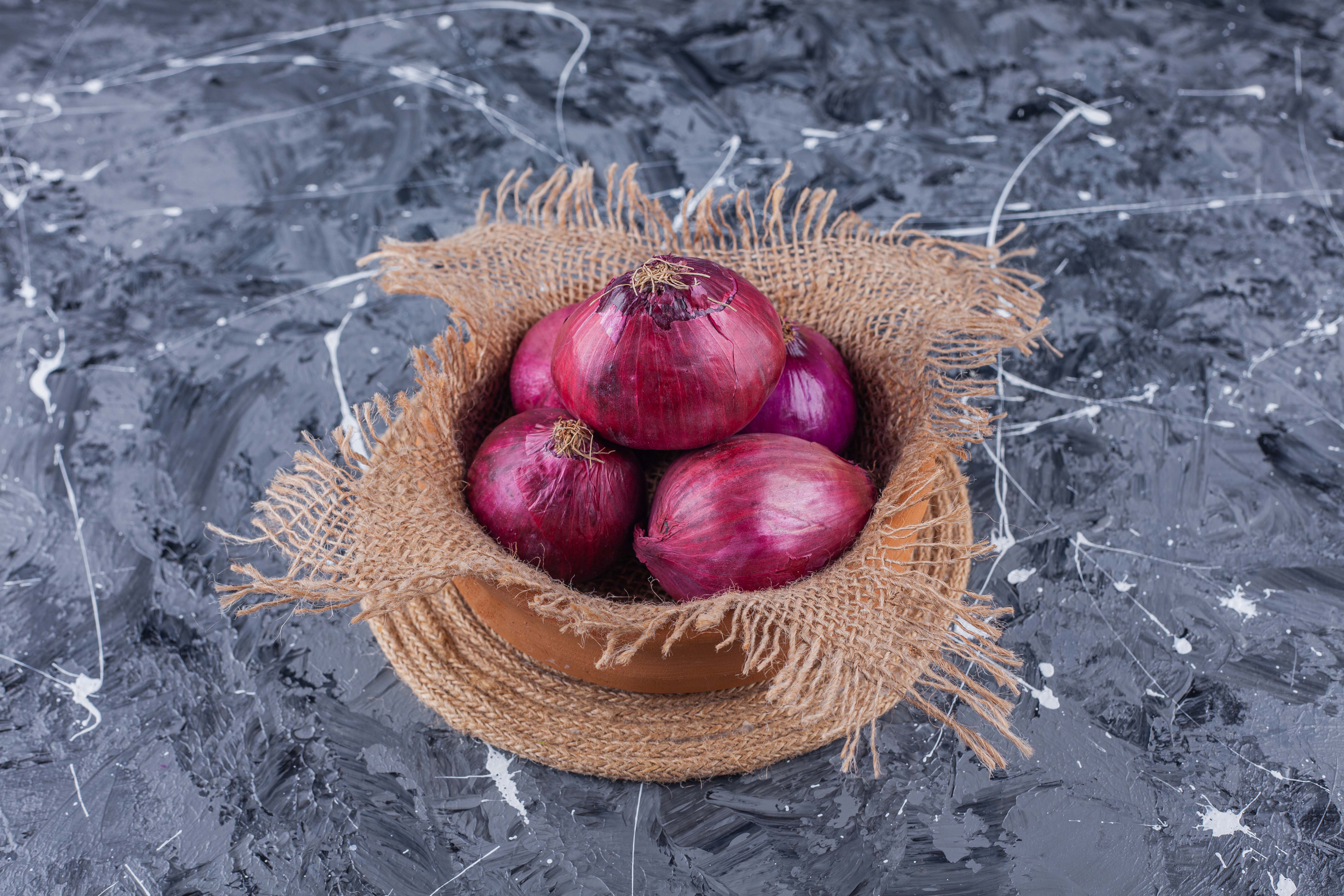 ceramic bowl fresh red onions blue surface.jpg ceramic bowl fresh red onions blue surface.jpg
